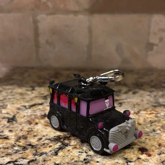 Haunted Black and Pink Toy Car Antibacterial Musical & Light Up Keychain - Picture 1 of 2